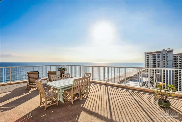 a kitchen with stainless steel appliances kitchen island granite countertop a refrigerator and a stove top oven