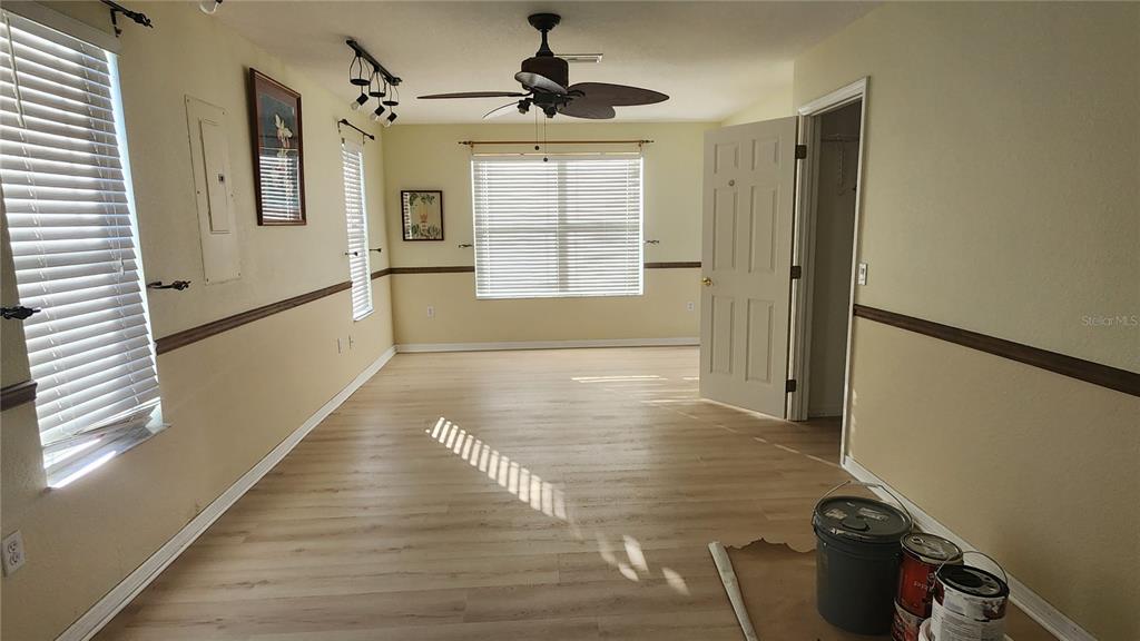 Undisclosed Address North Port, FL 34287 - Photo 12 of 27 a hallway with sliding door and wooden floor