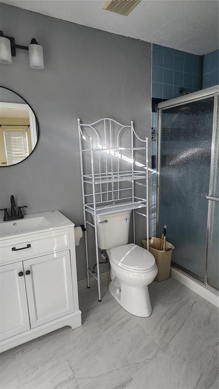 Undisclosed Address North Port, FL 34287 - Photo 14 of 27 a bathroom with a toilet sink and shower