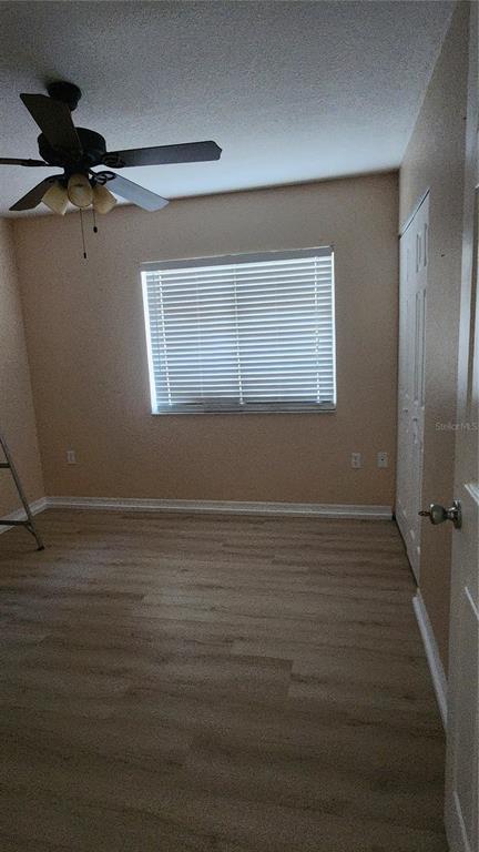 Undisclosed Address North Port, FL 34287 - Photo 19 of 27 a view of an empty room with wooden floor and a window