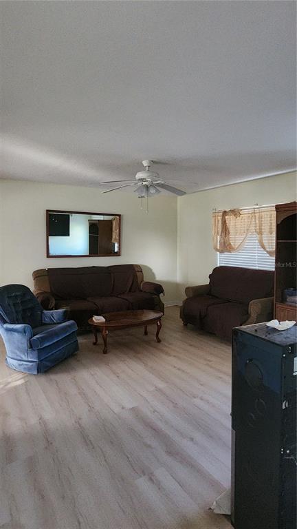 Undisclosed Address North Port, FL 34287 - Photo 24 of 27 a living room with furniture gym equipment and a flat screen tv