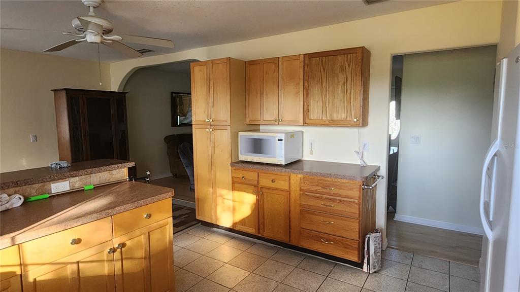 Undisclosed Address North Port, FL 34287 - Photo 25 of 27 a kitchen with stainless steel appliances granite countertop a refrigerator and a stove top oven