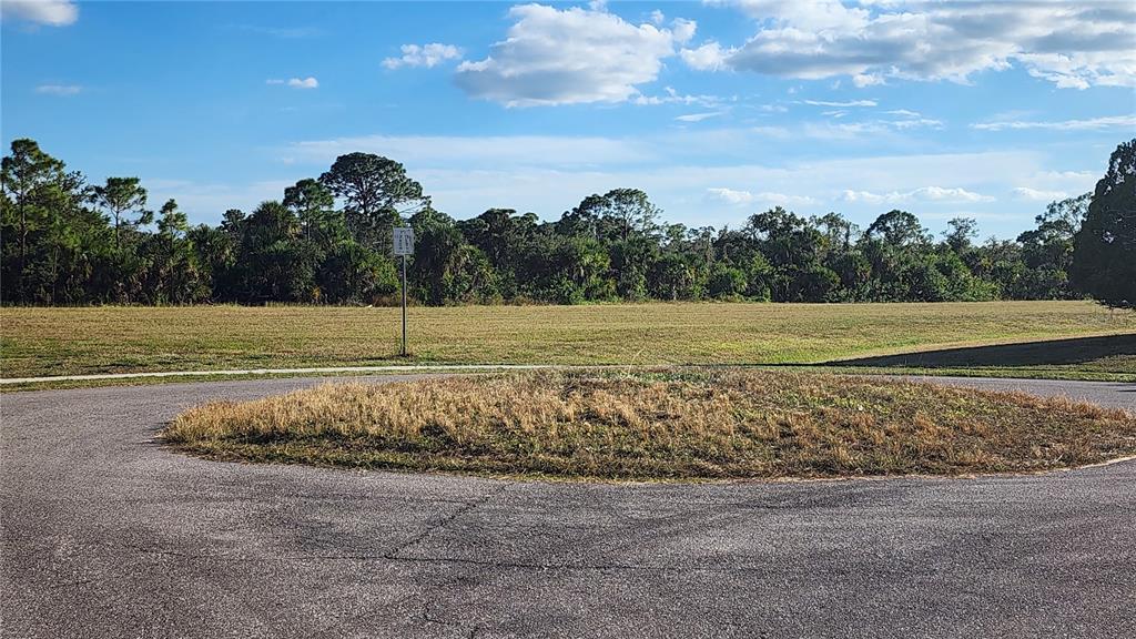 Undisclosed Address North Port, FL 34287 - Photo 27 of 27 a view of a field with an trees in the background