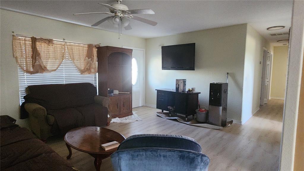 Undisclosed Address North Port, FL 34287 - Photo 10 of 27 a living room with furniture and a flat screen tv