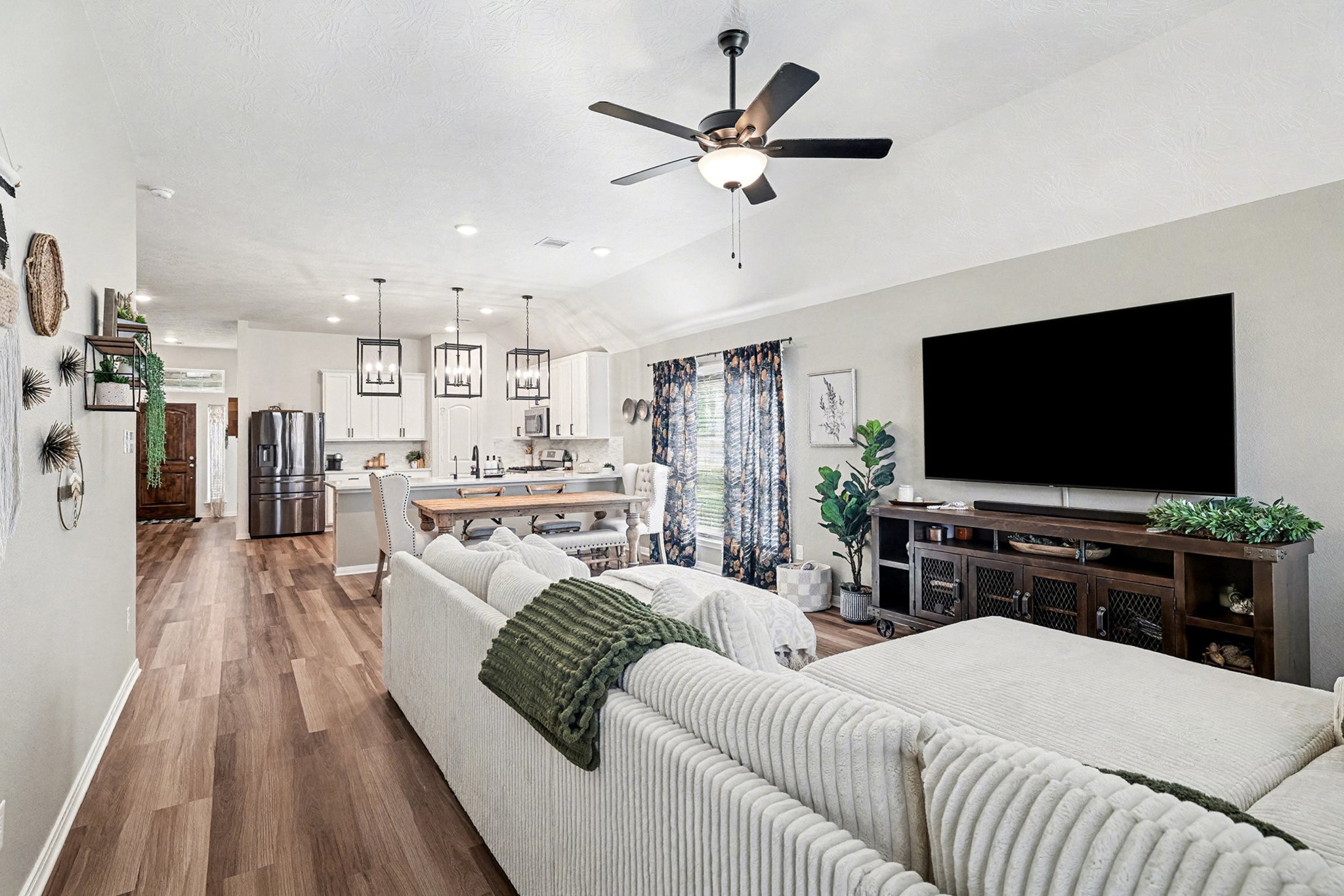 3309 Rolling View Court Conroe, TX 77301 - Photo 11 of 27 The stellar kitchen seamlessly flows into the amazing living room.