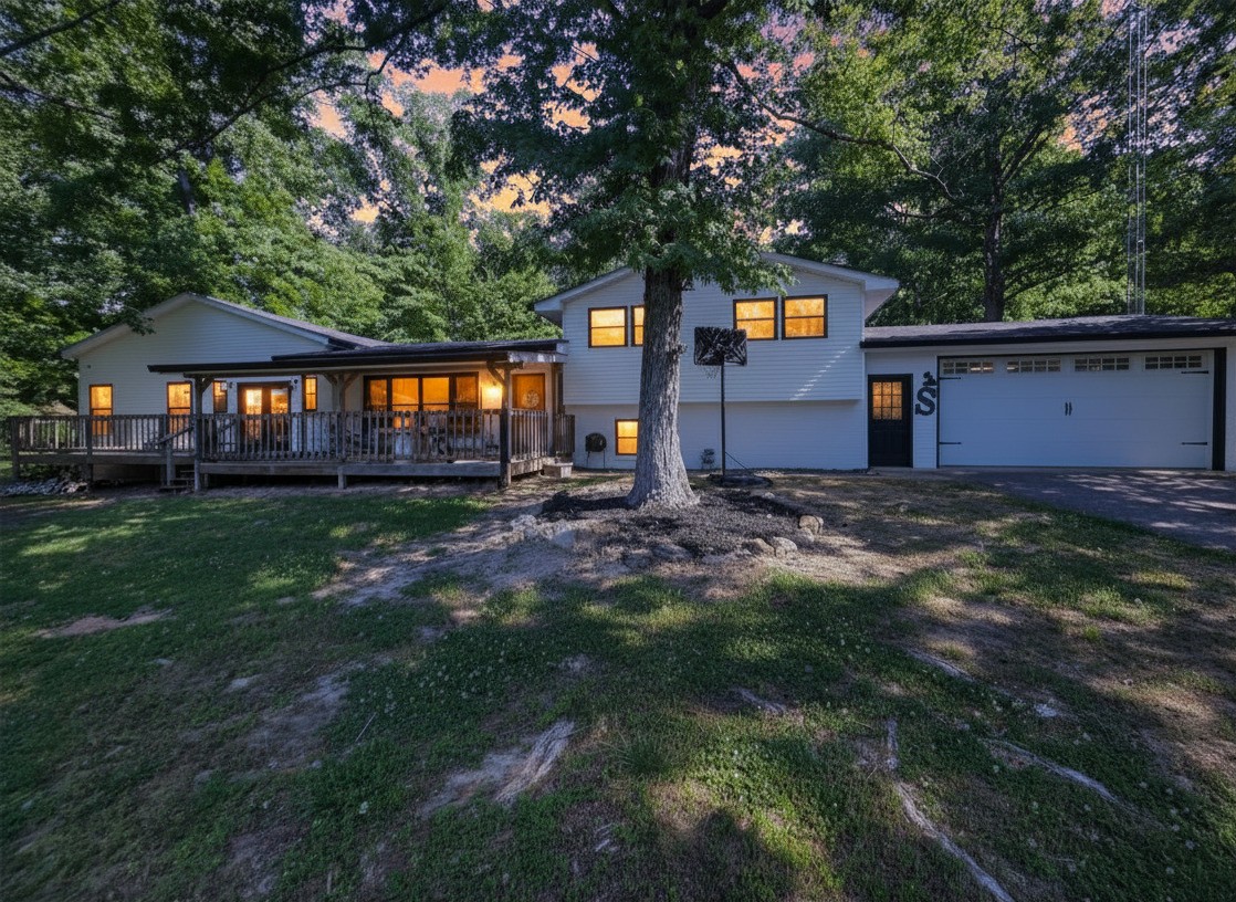 1975 Kelly Road Holladay, TN 38341 - Photo 29 of 95 a front view of a house with a yard and lake view