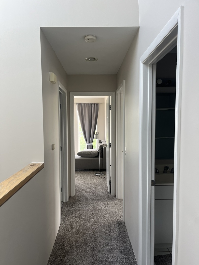 501 Kelburn Road Deerfield, IL 60015 - Photo 9 of 15 a view of a livingroom and a hallway