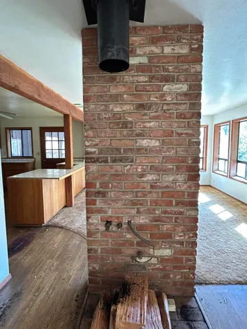 a view of a livingroom with an empty space and a sink
