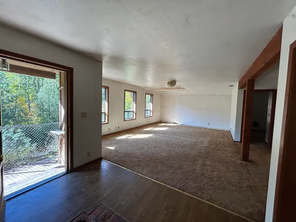a view of an empty room with windows