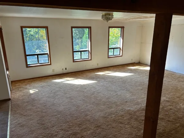 a view of an empty room with a window