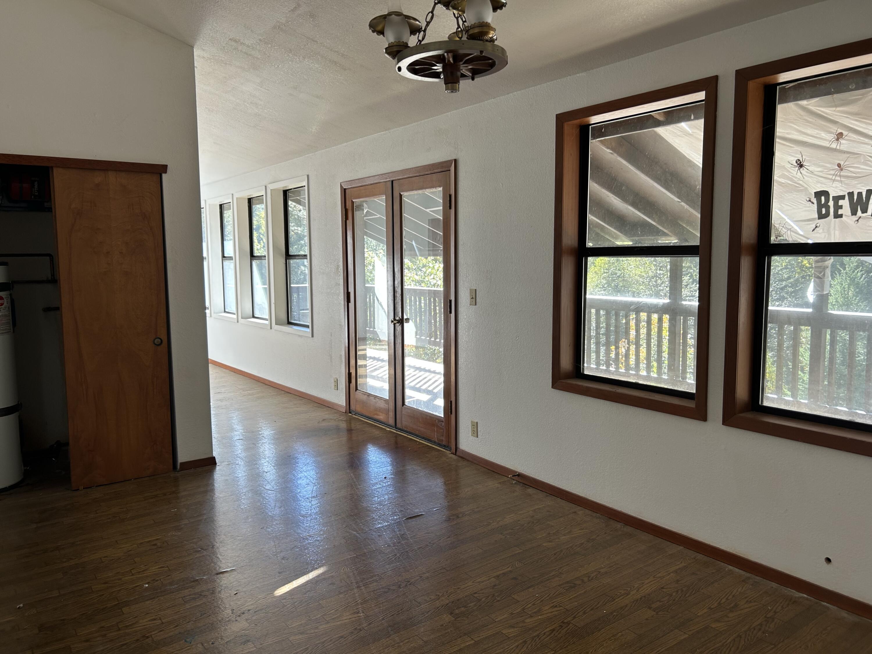30 Bear Canyon Road Lewiston, CA 96052 - Photo 26 of 64 a view of an room with wooden floor and windows