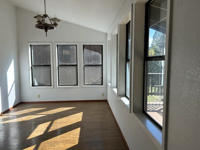 a view of a backyard of the house