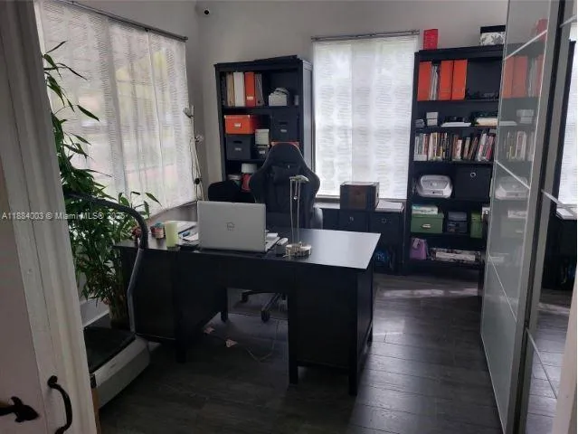 a laptop computer sitting on top of a table