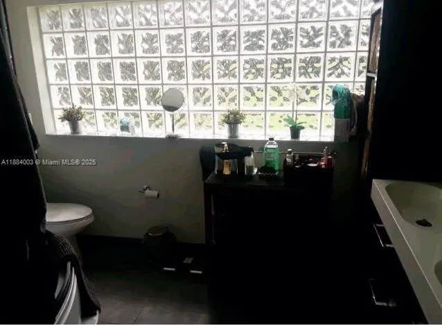 a bathroom with a sink vanity and a mirror