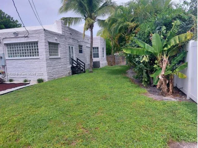 a view of a back yard of the house