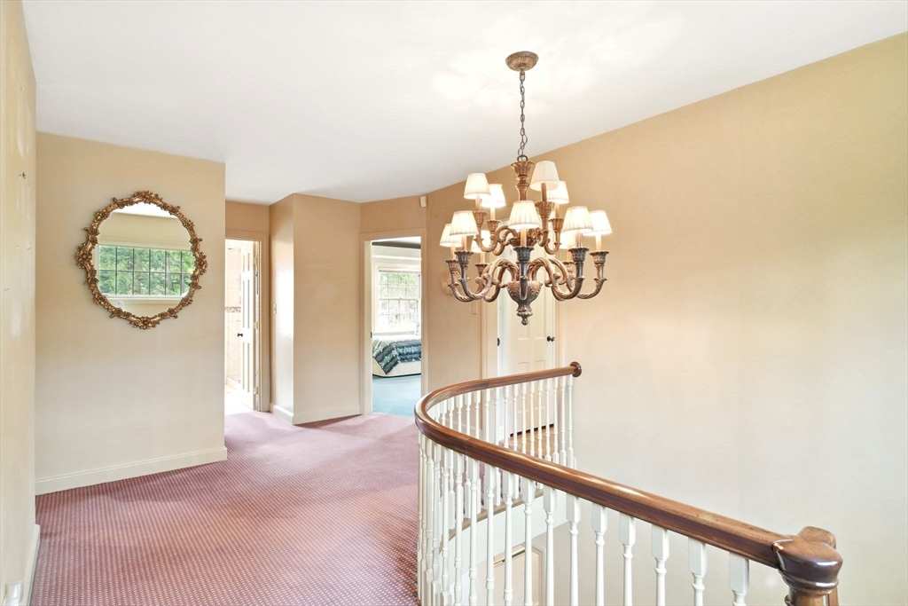 68 Normandy Road Longmeadow, MA 01106 - Photo 20 of 42 a view of a hallway with windows