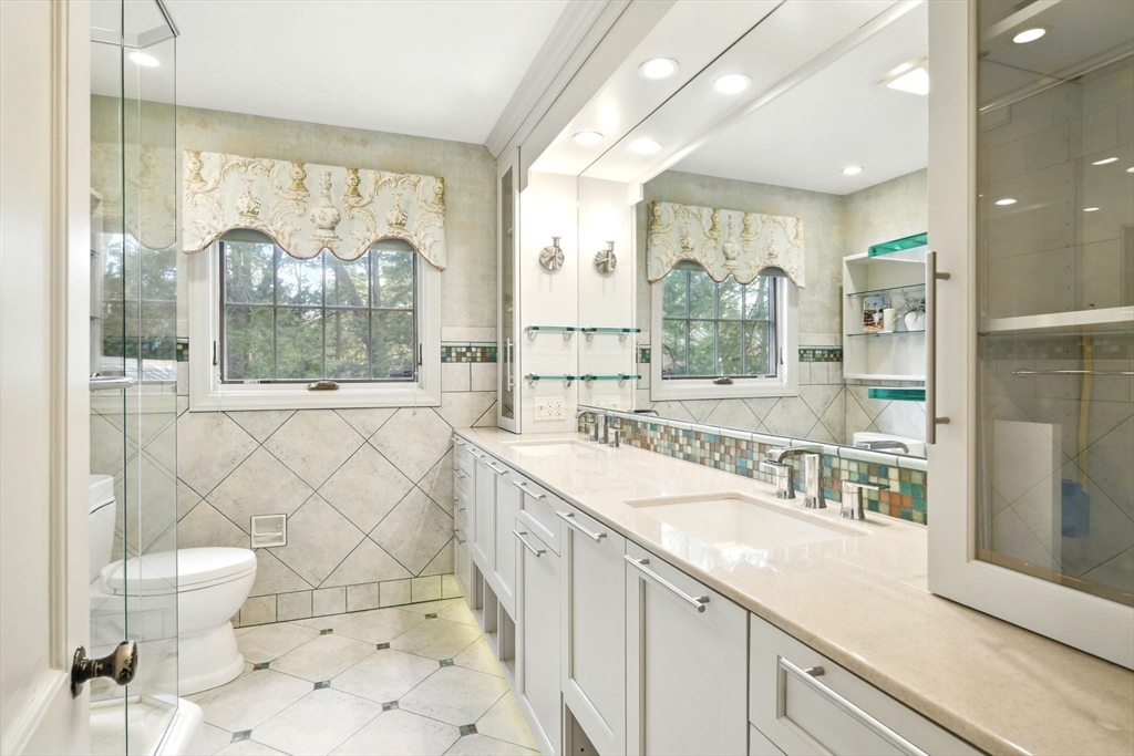 68 Normandy Road Longmeadow, MA 01106 - Photo 23 of 42 a large bathroom with a double vanity sink a mirror and a shower