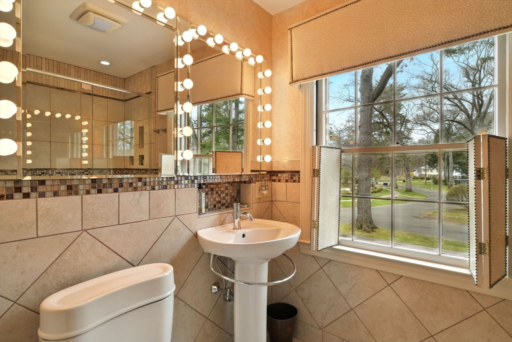 68 Normandy Road Longmeadow, MA 01106 - Photo 26 of 42 a bathroom with a sink a toilet and shower