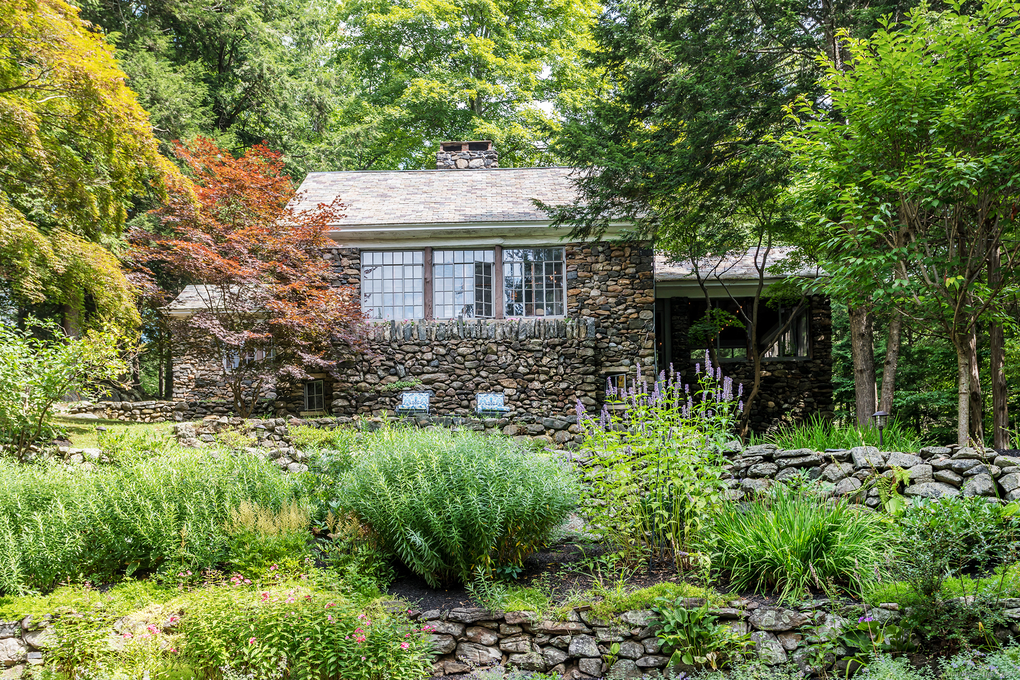 60 Leach Hollow Road Sherman, CT 06784 - Photo 6 of 24 a view of a house with a yard and potted plants