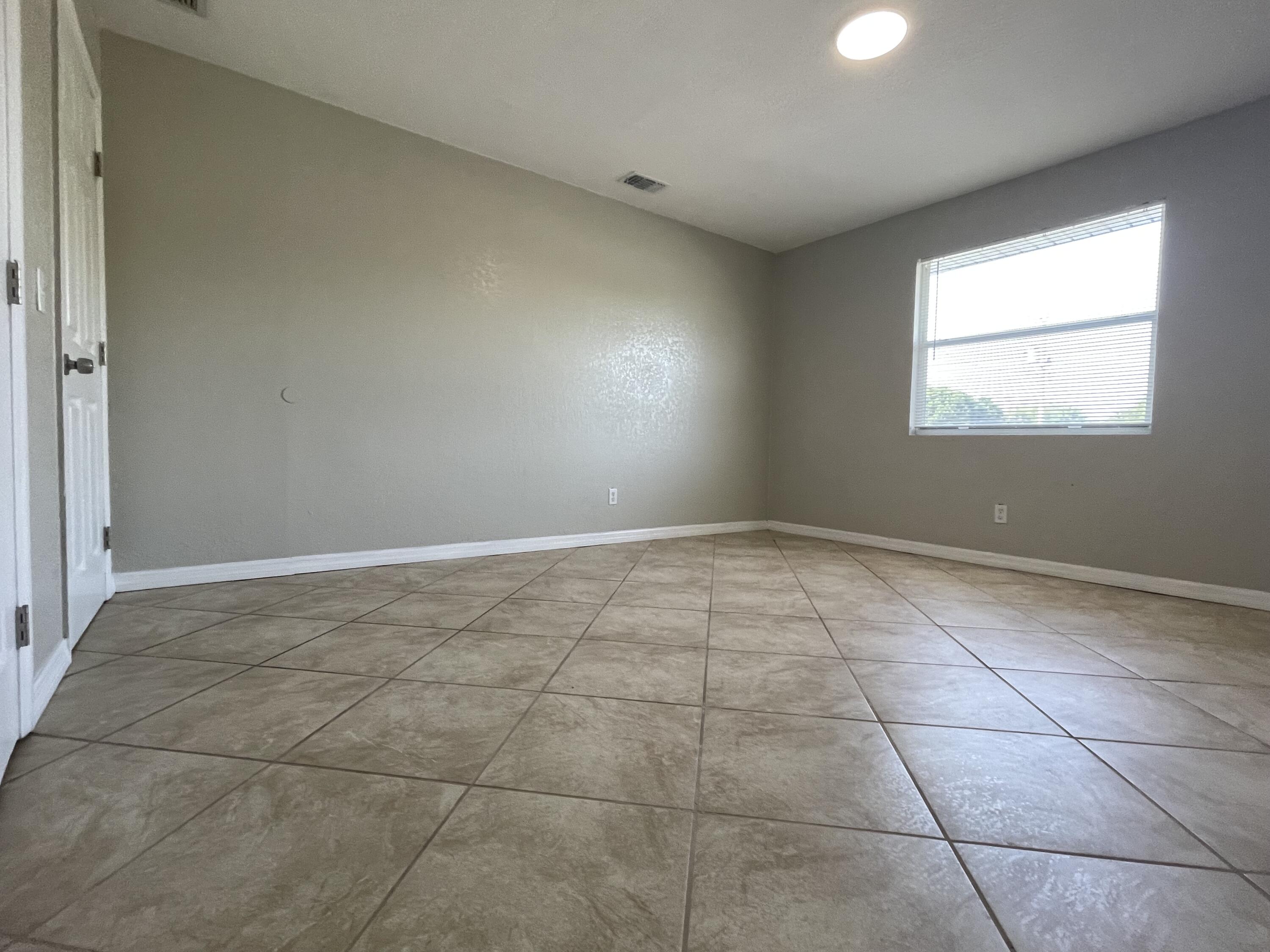 2880 Harson Way Fort Pierce, FL 34946 - Photo 18 of 40 a view of an empty room and window
