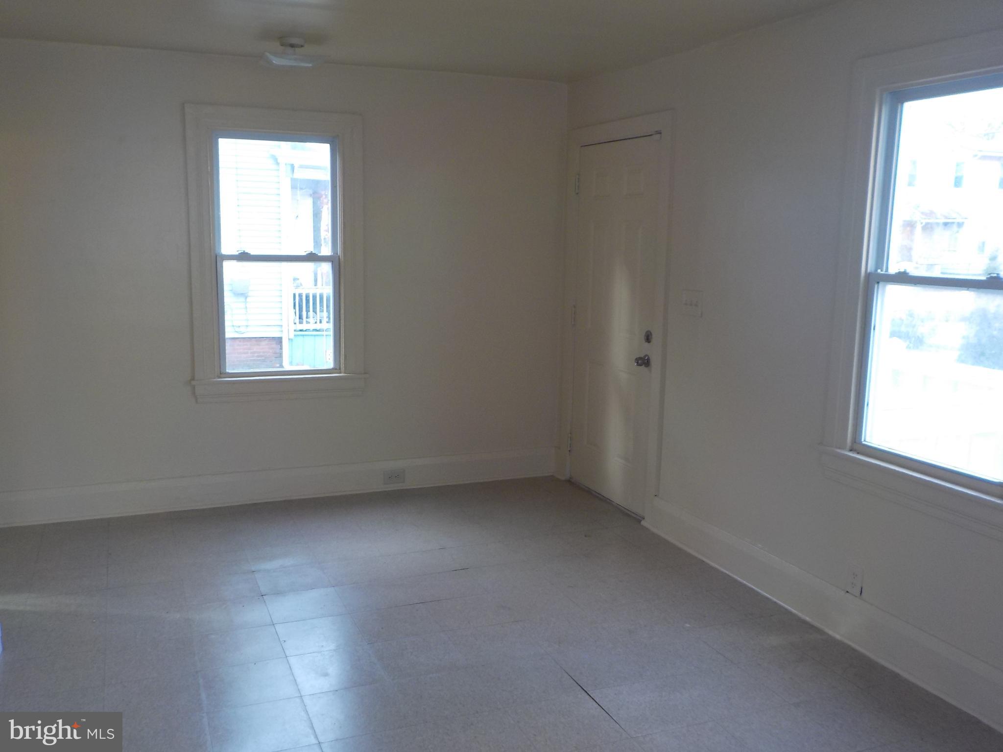 26 Walnut Street, Unit A Salem, NJ 08079 - Photo 3 of 11 an empty room with a window