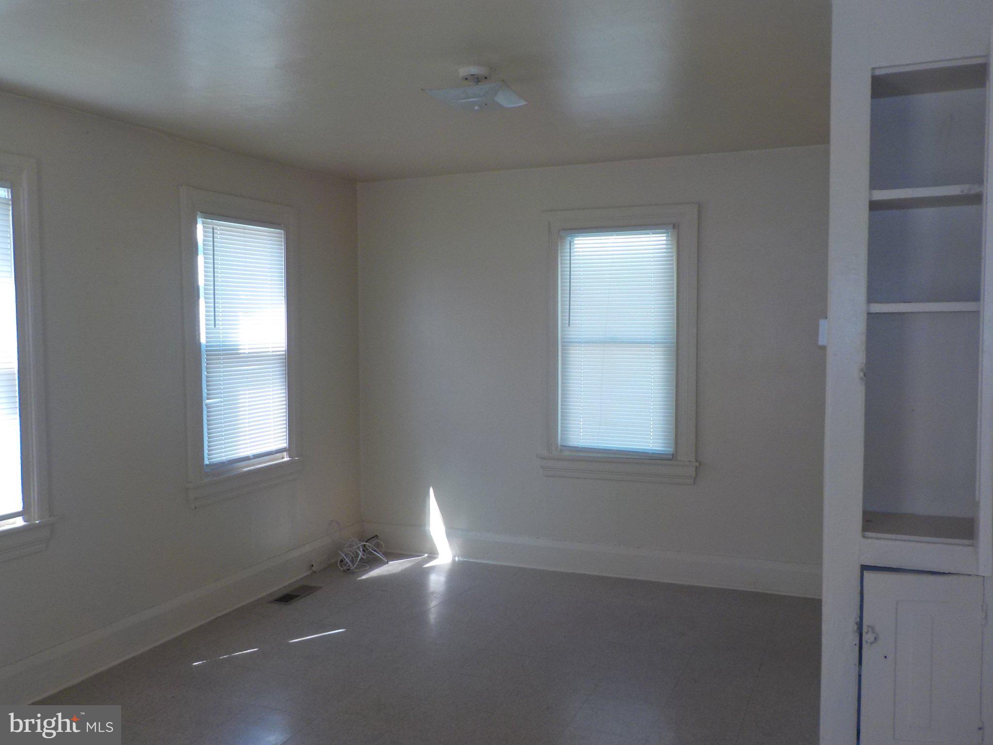 26 Walnut Street, Unit A Salem, NJ 08079 - Photo 7 of 11 an empty room with a window