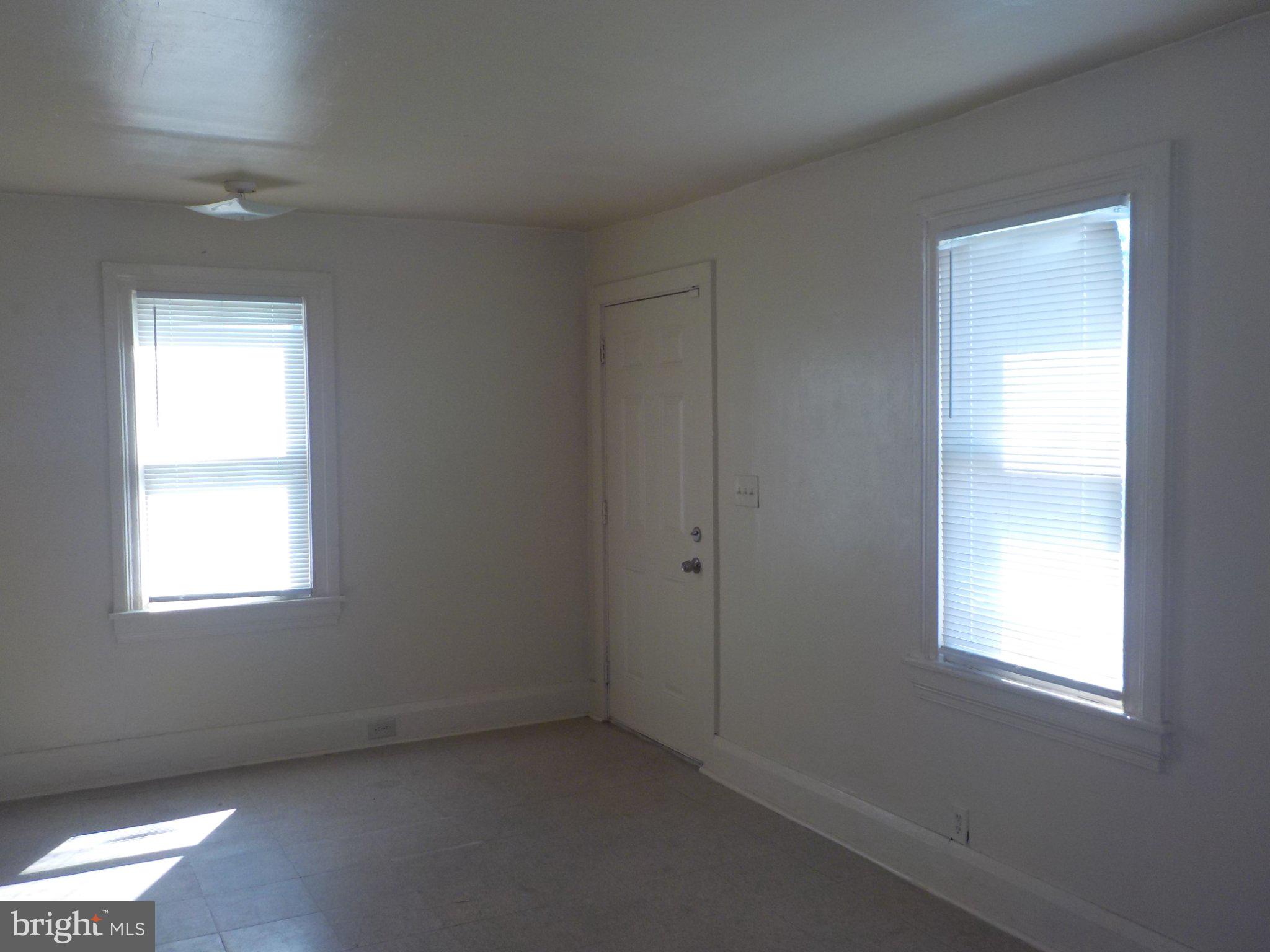 26 Walnut Street, Unit A Salem, NJ 08079 - Photo 8 of 11 an empty room with a window
