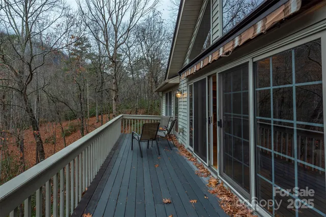 a view of balcony with wooden floor and bench