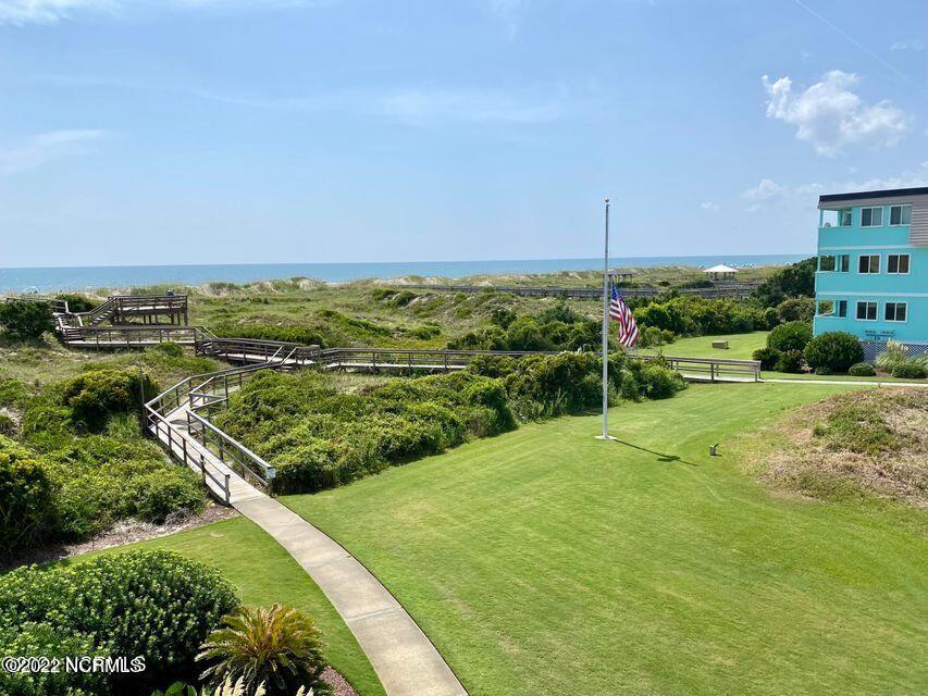 301 Commerce Way, Unit 233 Atlantic Beach, NC 28512 - Photo 6 of 11 Outside with Flag