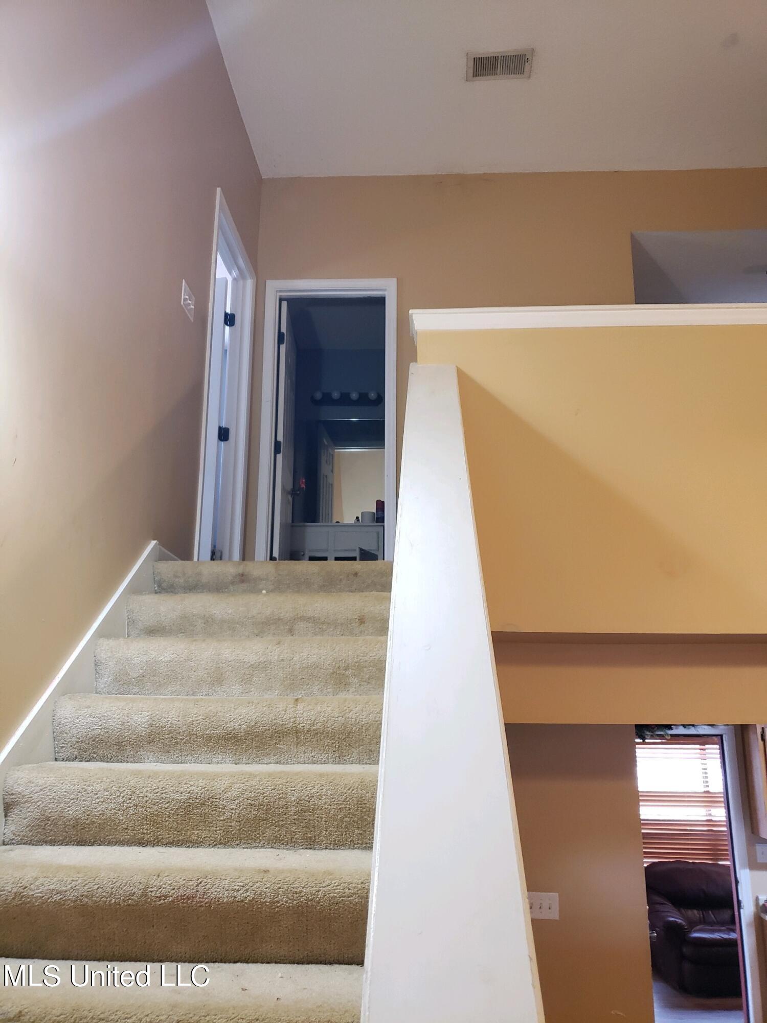 193 Chickasaw Ridge Pope, MS 38658 - Photo 15 of 23 Stairs to BR 2 and Loft