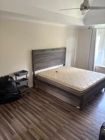 a bedroom with a bed and a mirror