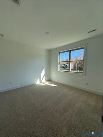 a bathroom with a granite countertop sink mirror and a toilet