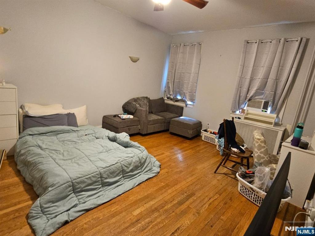 303 Hamilton Place, Unit B4 Hackensack, NJ 07601 - Photo 7 of 9 a bedroom with two beds and a desk