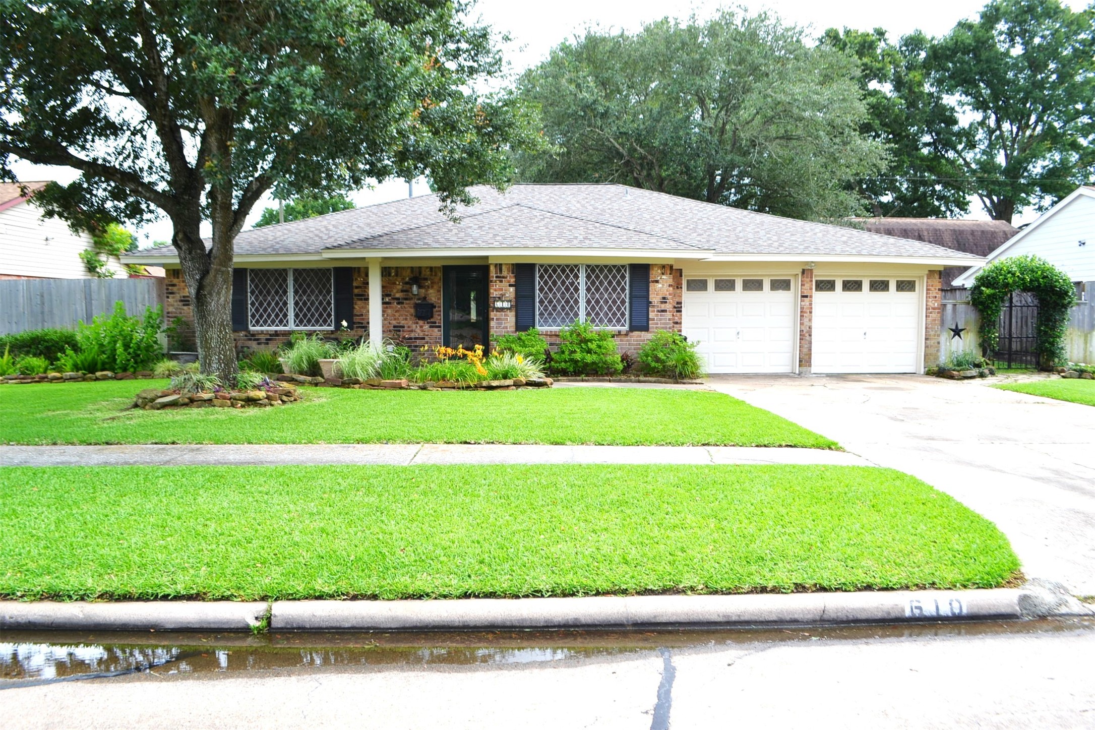 610 East X Street Deer Park, TX 77536 - Photo 1 of 44 a front view of a house with a garden and plants