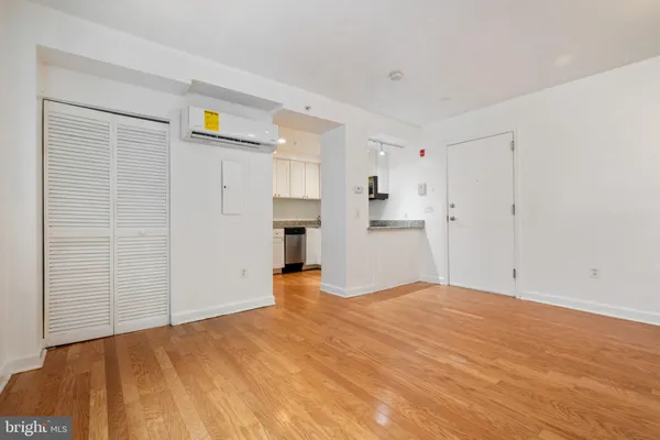 a view of a kitchen with wooden floor and a kitchen