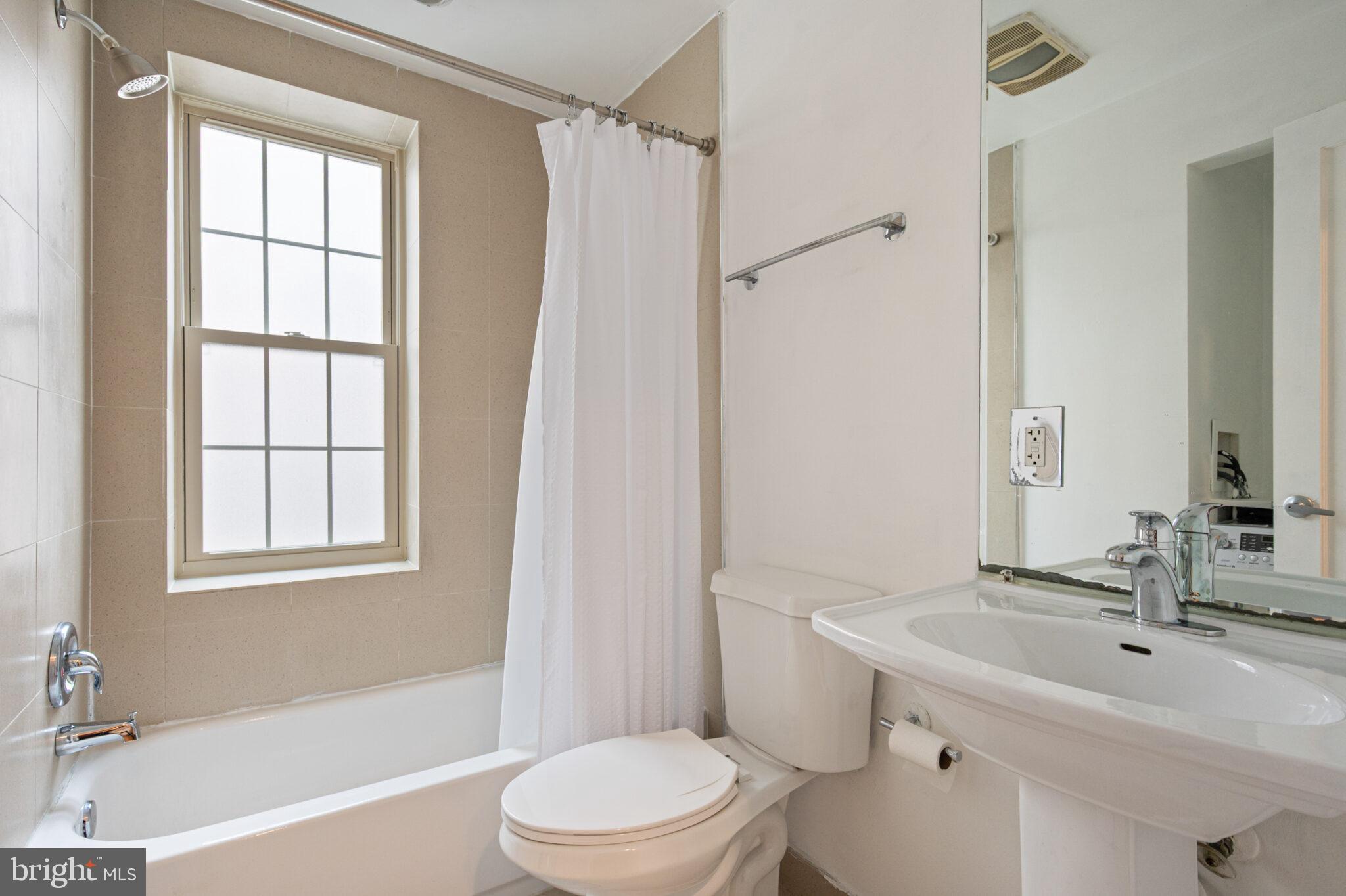 1314 Massachusetts Avenue Northwest, Unit 608 Washington, DC 20005 - Photo 18 of 40 a bathroom with a sink toilet and shower