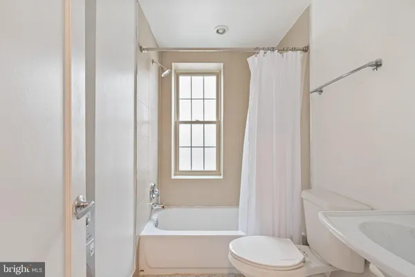 a bathroom with a sink a washer and dryer