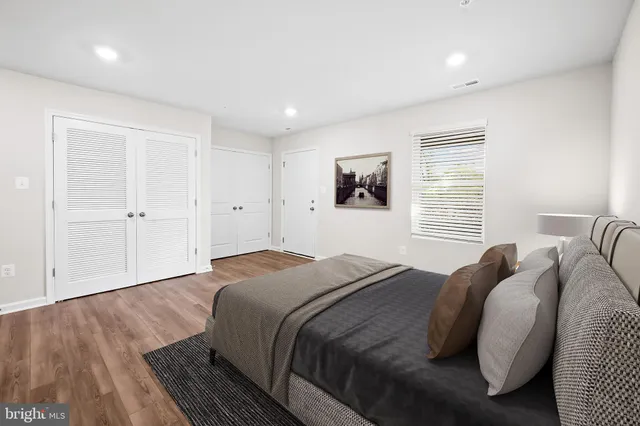 a bed room with a bed and a window