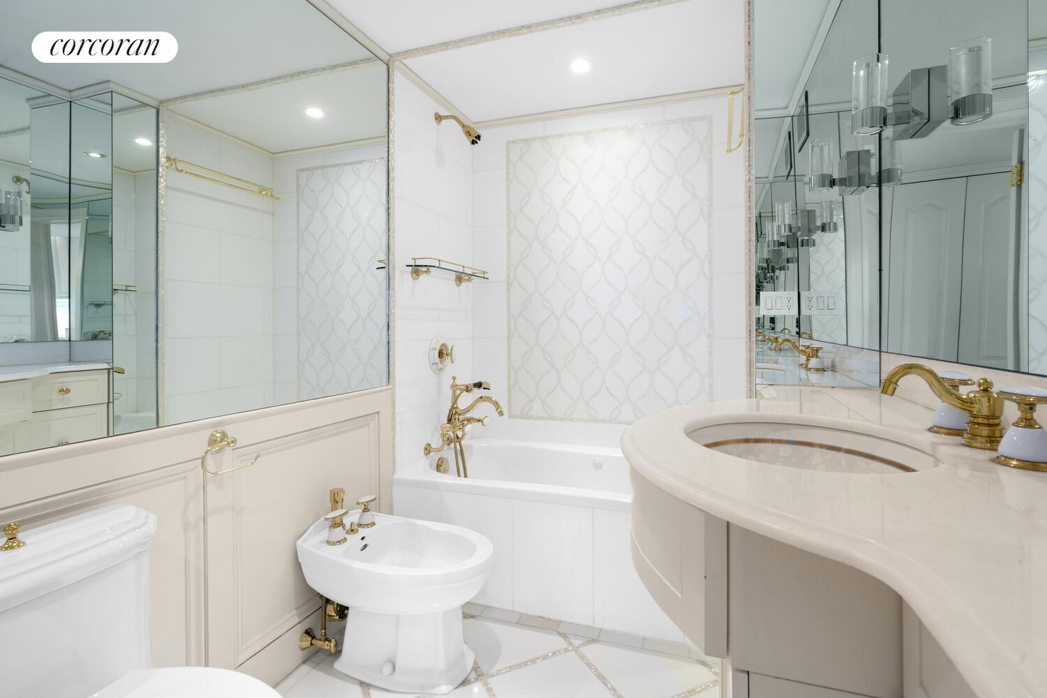 27 East 65th Street, Unit 14CD Manhattan, NY 10065 - Photo 13 of 16 a bathroom with a sink toilet tub and shower