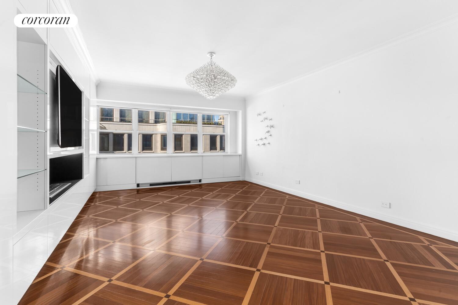 27 East 65th Street, Unit 14CD Manhattan, NY 10065 - Photo 2 of 16 a view of an empty room with a window