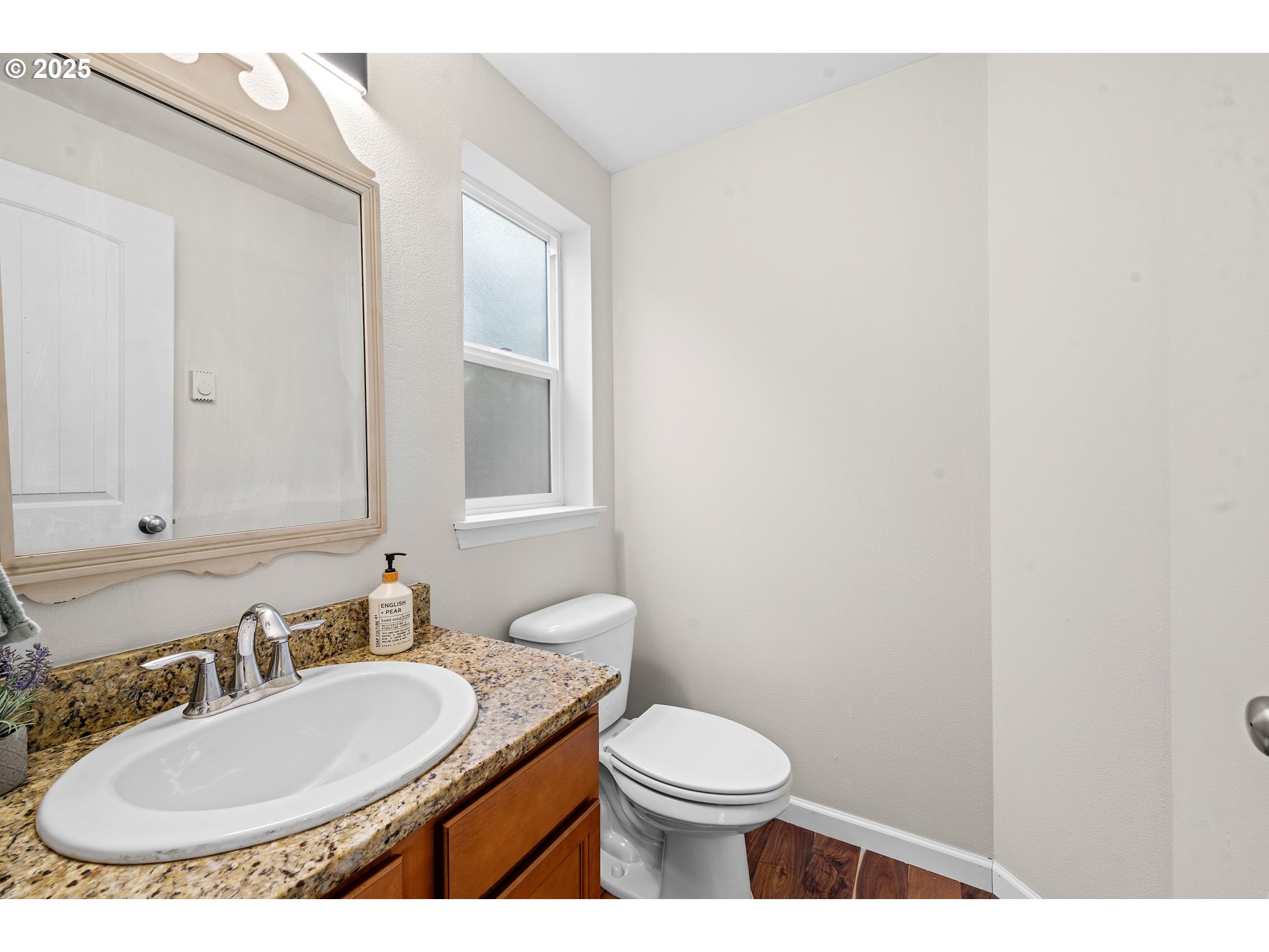 1225 3rd Avenue Hammond, OR 97121 - Photo 18 of 47 a bathroom with a toilet a sink and mirror