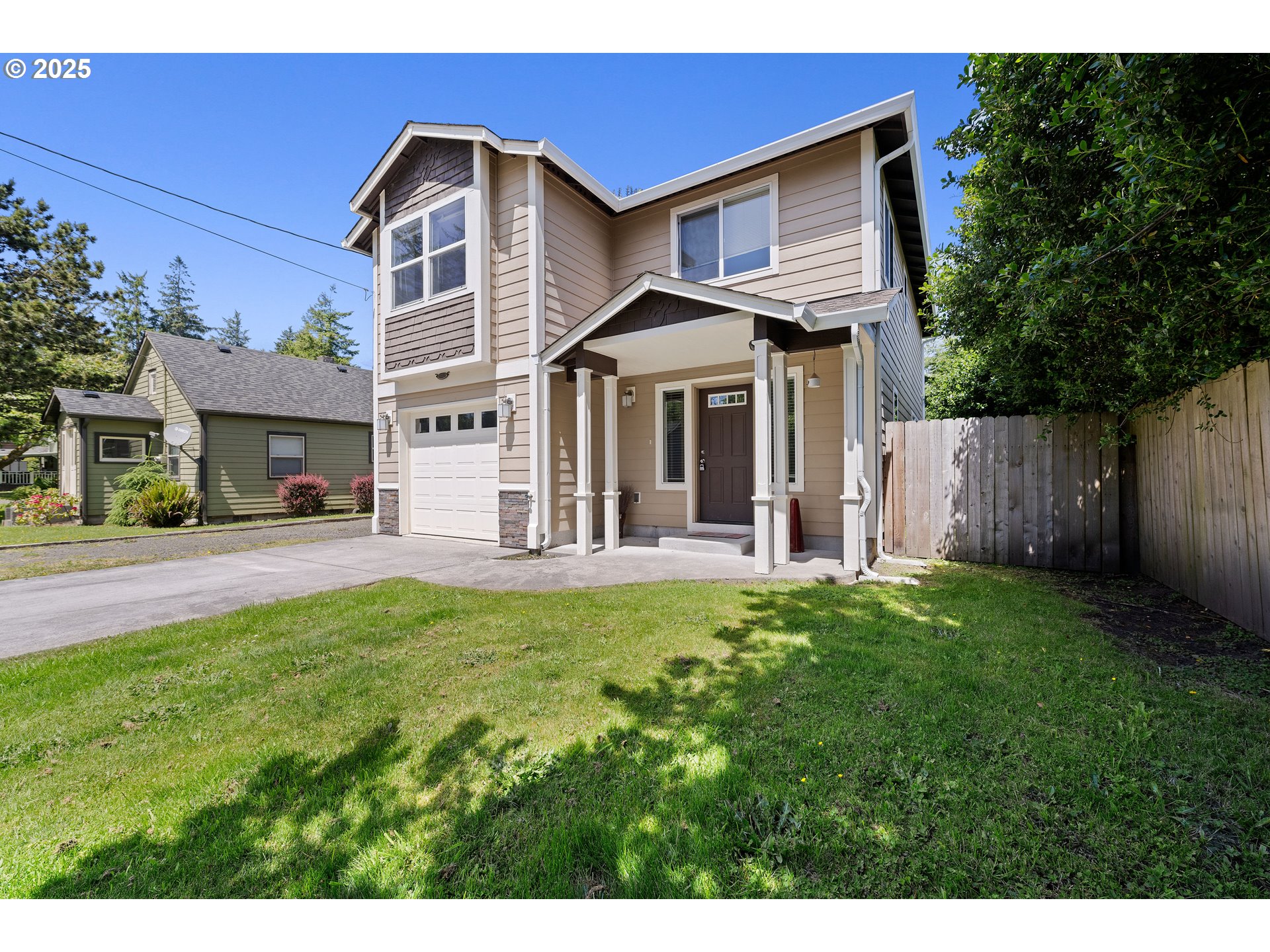 1225 3rd Avenue Hammond, OR 97121 - Photo 2 of 47 a front view of a house with a yard