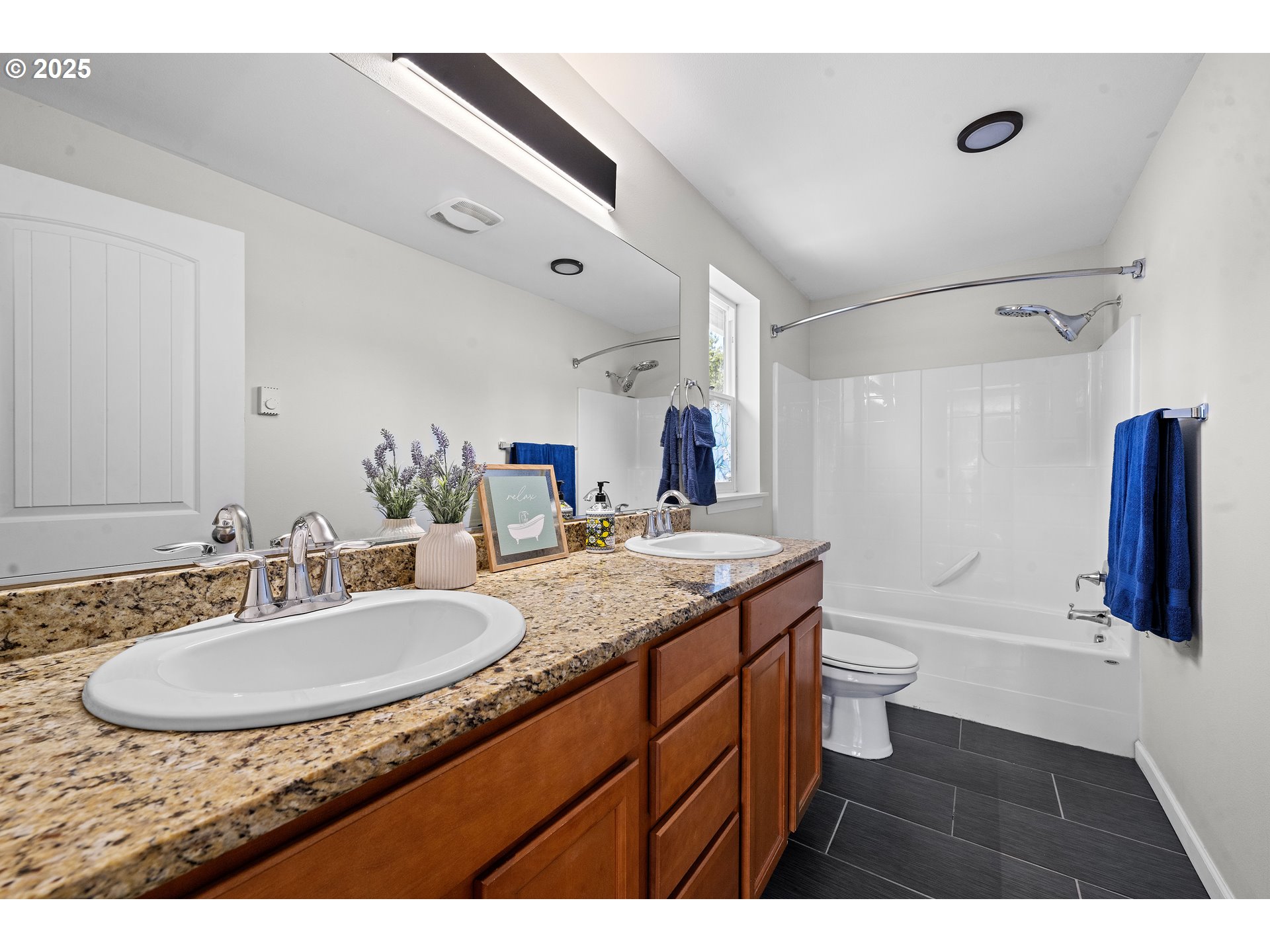 1225 3rd Avenue Hammond, OR 97121 - Photo 23 of 47 a bathroom with a granite countertop sink and a mirror