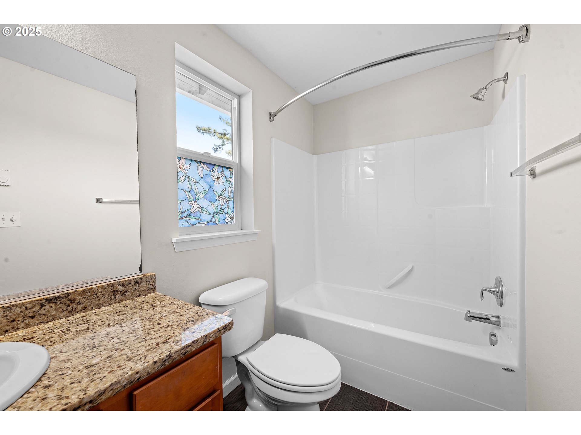 1225 3rd Avenue Hammond, OR 97121 - Photo 28 of 47 a bathroom with a granite countertop sink toilet a mirror and a tub