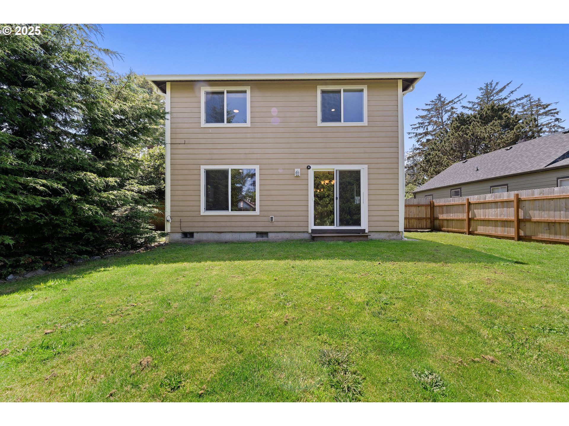 1225 3rd Avenue Hammond, OR 97121 - Photo 39 of 47 a view of a house with a backyard
