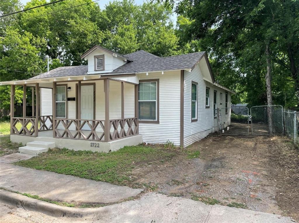 2722 Hector Street Dallas, TX 75210 - Photo 2 of 10 a front view of a house with a yard