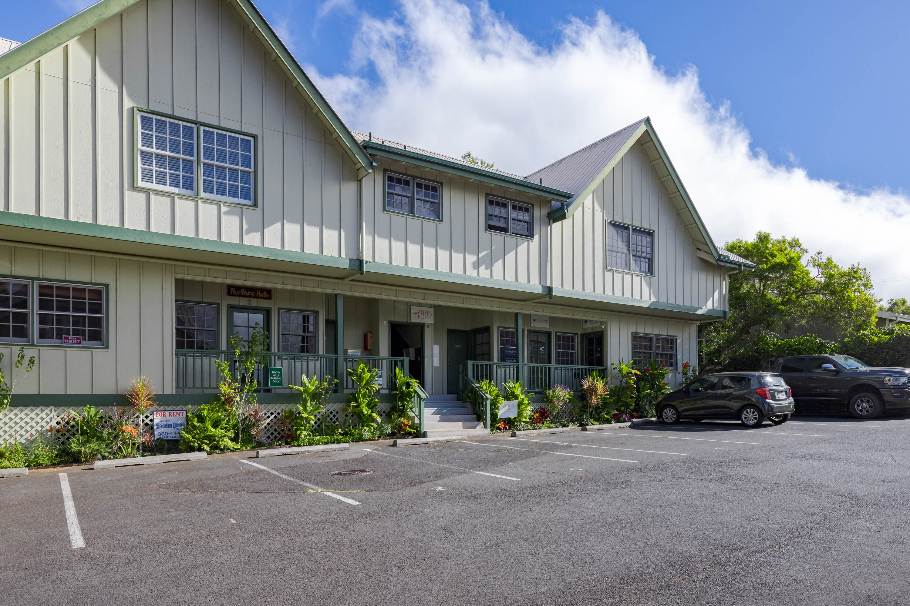 65-1235 Opelo Road, Unit 5 Kamuela, HI 96743 - Photo 2 of 17 a front view of a house with yard and a garden