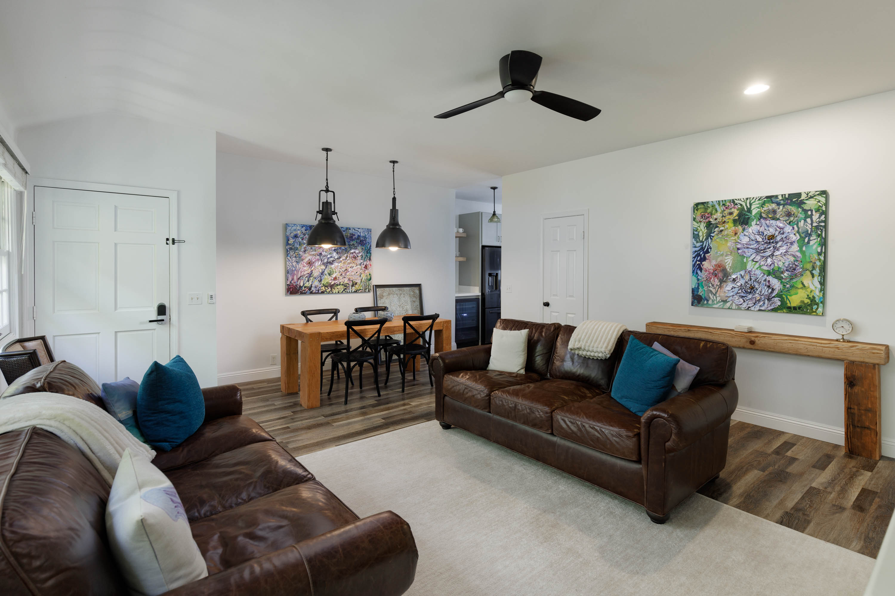65-1235 Opelo Road, Unit 5 Kamuela, HI 96743 - Photo 3 of 17 a living room with furniture and a chandelier