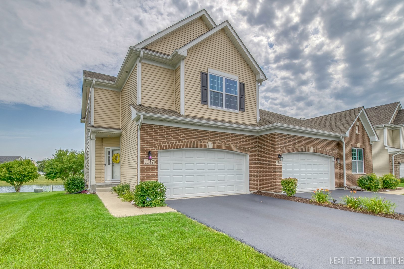 1147 Freedom Road Elburn, IL 60119 - Photo 1 of 21 a front view of house with yard and green space
