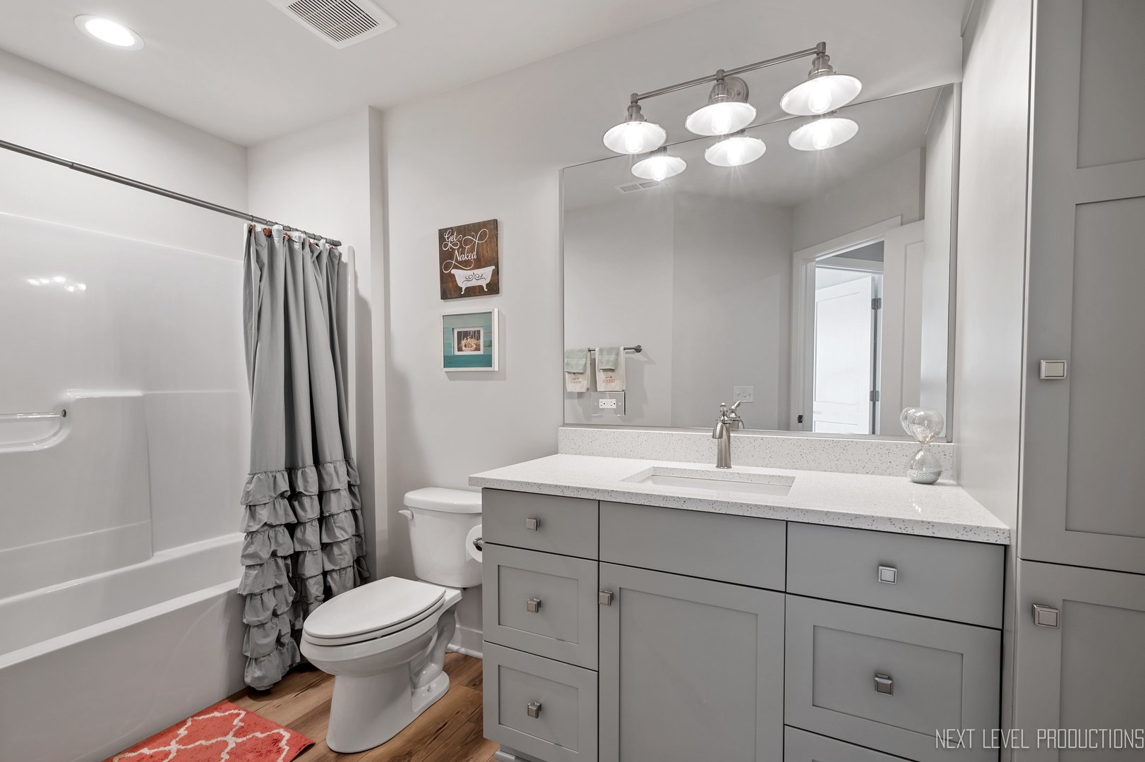 1147 Freedom Road Elburn, IL 60119 - Photo 16 of 21 a bathroom with a toilet a sink a tub and mirror